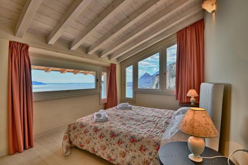 En eller flere senge i et værelse på Attico Elais - Theater Home