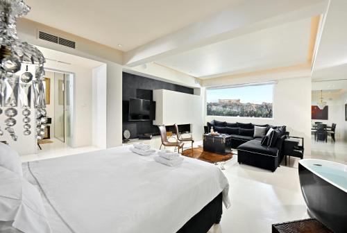 Posteľ alebo postele v izbe v ubytovaní ALTO PSYRRI PENTHOUSE by K&K