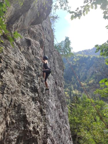 a person climbing on a rock wall at Kerbihan in Vénosc