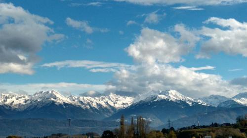 a view of a snow covered mountain range at Gîte clair, spacieux et cosy avec vue sur le massif de la Chartreuse in Sainte-Hélène-du-Lac