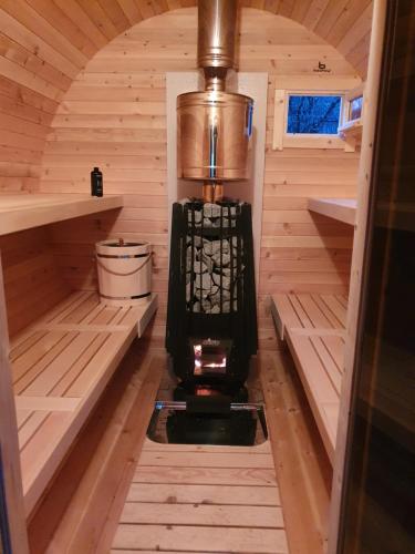 an inside view of a stove in a sauna at Imperator Kvintil apartmani & SPA in Ležimir