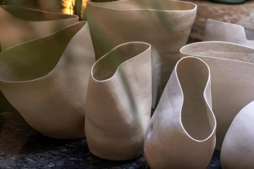 a group of white vases sitting next to each other at Can Cera Hotel in Palma de Mallorca