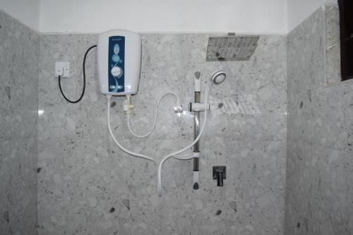 a bathroom with a shower with an oxygen tank and aeth at Villa 307 3 room apartment in Matara