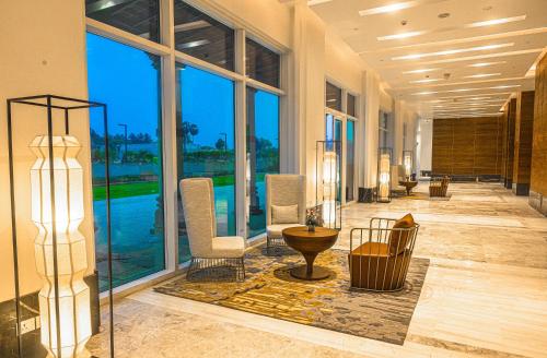 a lobby with a large room with large windows at Welcomhotel by ITC Hotels, Bhubaneswar in Bhubaneshwar