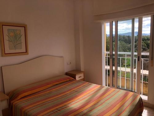 Кровать или кровати в номере La Riviera - Serviden