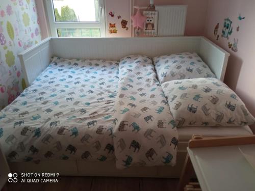 Postel nebo postele na pokoji v ubytování Sanshiro apartment