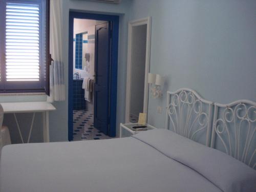 Letto o letti in una camera di Hotel La Lampara