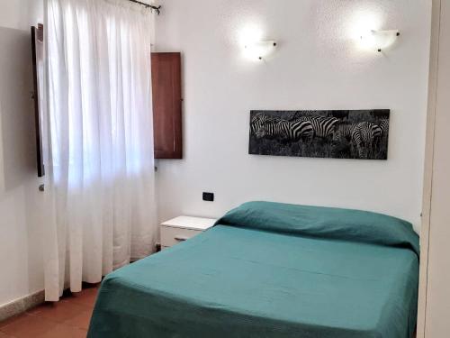 Letto o letti in una camera di Villa Raffaello