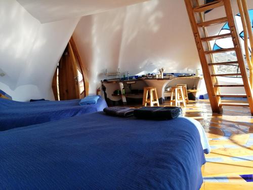 Postel nebo postele na pokoji v ubytování Hostal Las Olas