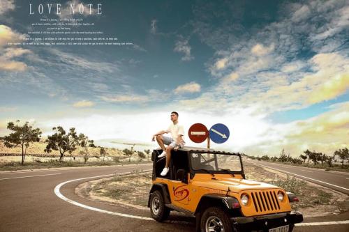 a man sitting on top of a jeep on the road at Hoang Nga Garden Guesthouse in Mui Ne