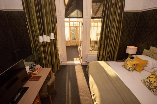 a hotel room with a bed and a window at One Devonshire Gardens a Hotel Du Vin in Glasgow