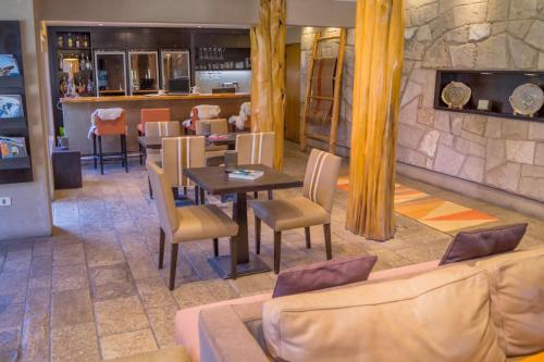 a dining room with a table and chairs at Galileo Boutique Hotel in San Carlos de Bariloche