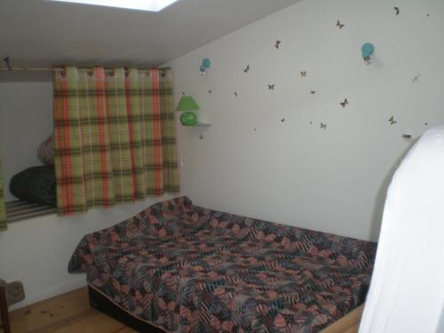 En eller flere senge i et værelse på Maison du Chapitel