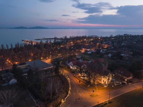 an aerial view of a city at night at Neptun Badacsony in Badacsonytomaj