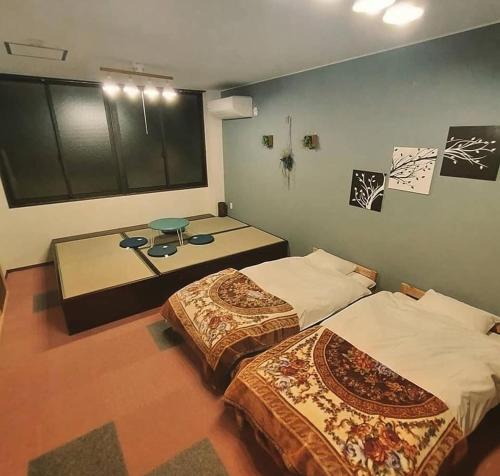 Posteľ alebo postele v izbe v ubytovaní Gerobal Hostel