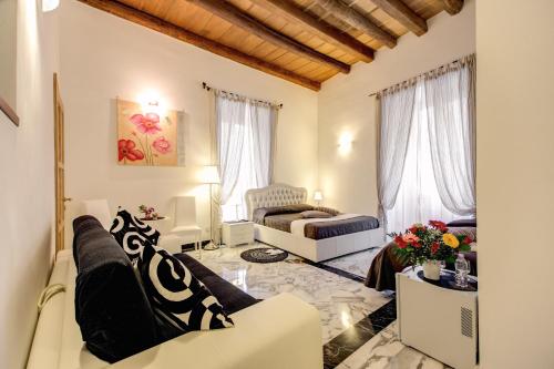 a living room with a couch and a chair at MyTimeRome in Rome