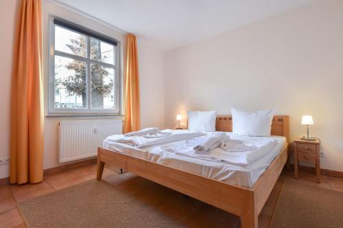Un pat sau paturi într-o cameră la Appartement Solaris 11