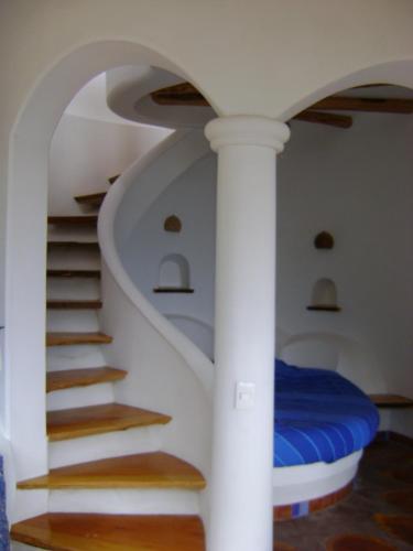Postel nebo postele na pokoji v ubytování Hostal Las Olas