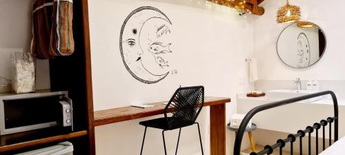 a room with a desk and a chair and a sink at Hotel Casa HX - Adults Only in Holbox Island