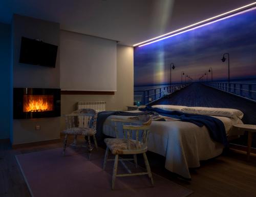 a room with a bed and a fireplace and a pier at Posada Valle de Güemes in Güemes