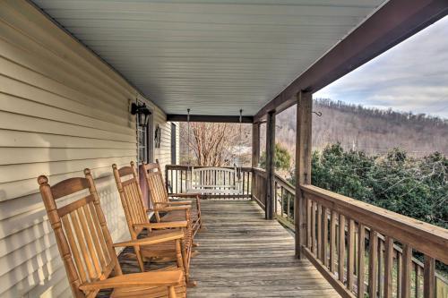 a porch with rocking chairs on a house at Spacious Faber Home with Yard, Steps to Winery! in Faber