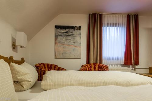 Ένα ή περισσότερα κρεβάτια σε δωμάτιο στο Landhotel Baumwipfel