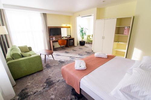 Ένα ή περισσότερα κρεβάτια σε δωμάτιο στο Kaiserhof Hotel