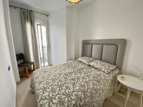Postel nebo postele na pokoji v ubytování Casa Animas Casasol Centro