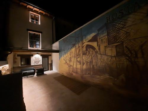 a large painting on the side of a building at Hostal La Rúa in Estella
