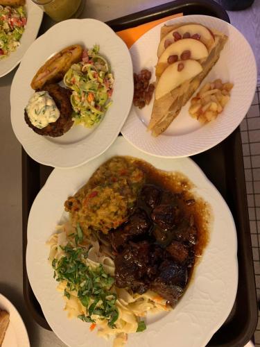 a group of plates of food on a tray at FH Confort Hotel Orléans Co'met in Orléans