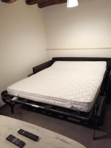 a mattress on a bed frame in a room at Gîte Le Courtil in Bouillon