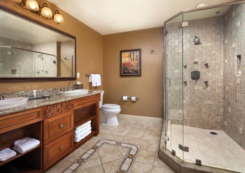 a bathroom with a shower and a sink at Vino Bello Resort in Napa