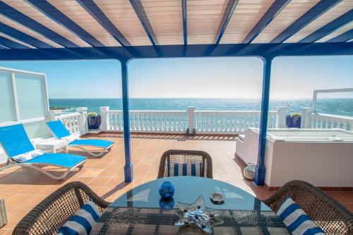 a living room with a view of the ocean at Seaview Coastal Home on front line with amazing sea views and large terrace in Puerto del Carmen