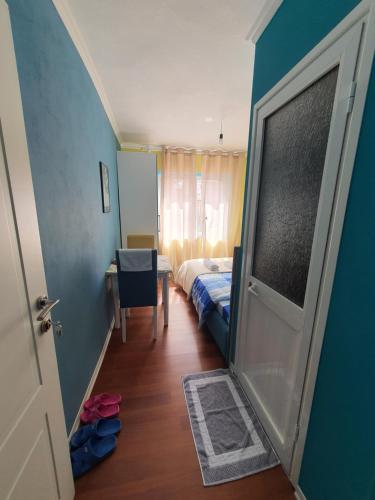 a room with a door leading to a bedroom at My Apartment Polican in Poliçan