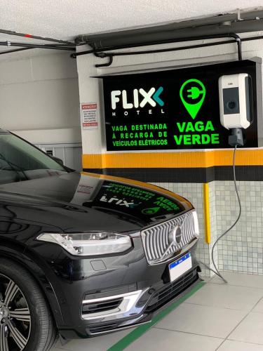 a car is charging in a car garage at Flix Hotel in Maceió
