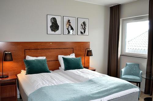 מיטה או מיטות בחדר ב-Thon Partner Hotel Central