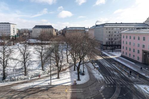 an aerial view of a city with snow and buildings at Scandic Kallio in Helsinki