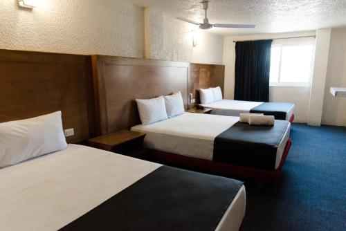 Postel nebo postele na pokoji v ubytování Hotel Central Irapuato - Hotel en Irapuato