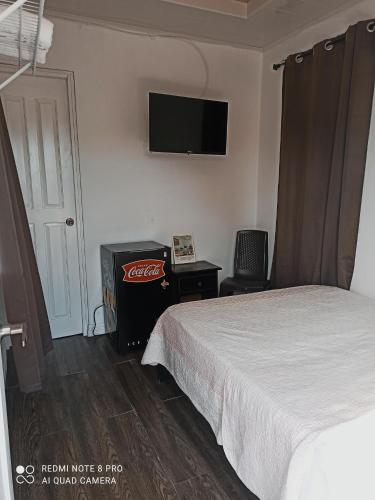 Cama o camas de una habitación en Hostal Compostela Inn
