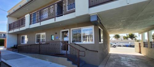 a building with balconies on the side of it at Beachwalker Inn & Suites in Pismo Beach