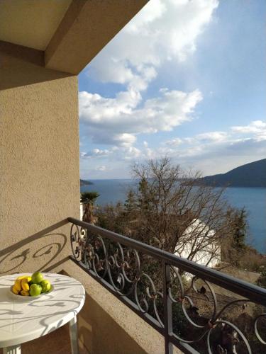 a bowl of fruit on a table on a balcony at Sunny Bay Apartments in Španjola