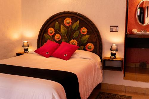 Una cama o camas en una habitación de Hotel Tepeyac