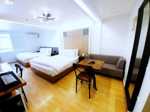 Uneed Hotelにあるベッド