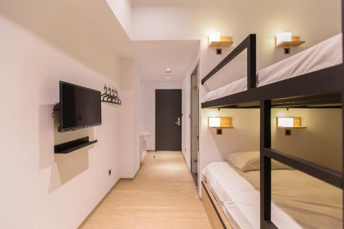 Postel nebo postele na pokoji v ubytování Taipei Sunny Hostel