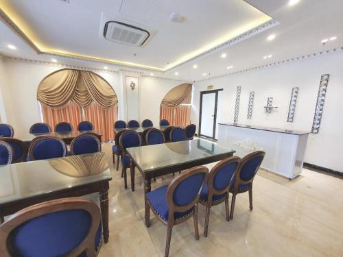 a conference room with a table and chairs in it at Kingdom Hotel Cua Lo in Cửa Lò