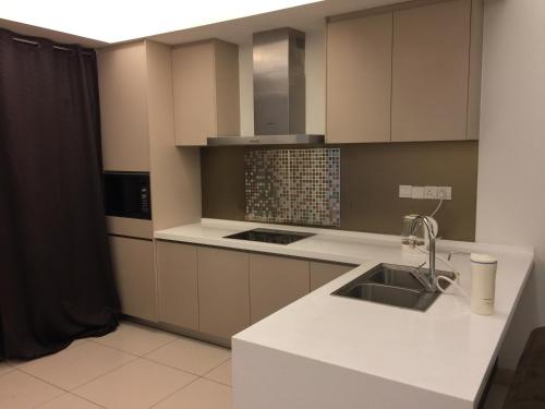 a kitchen with a sink and a counter top at KL TOWER & KLCC VIEW HOTEL SUITE @ SUASANA BUKIT CEYLON BUKIT BINTANG in Kuala Lumpur