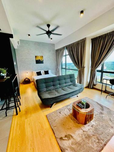 a large living room with a couch and a bed at Kuantan Imperium by Glex in Kuantan
