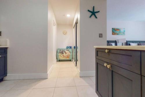 a kitchen with a counter and a hallway at Little Harbor Resort #510 Tampa Bay FL Beach, Hot Tub, Pools in Ruskin