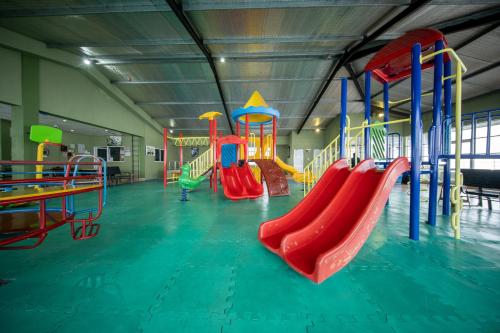 a play room with a playground with slides and slidesktop at Olympus Plaza Hotel in Haputale