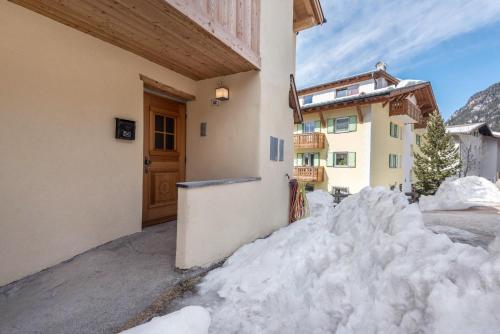 a pile of snow in front of a building at Majon Baticher in Canazei